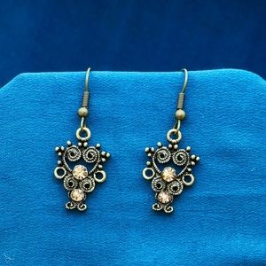 Bronze coloured earrings with brown gemstones.